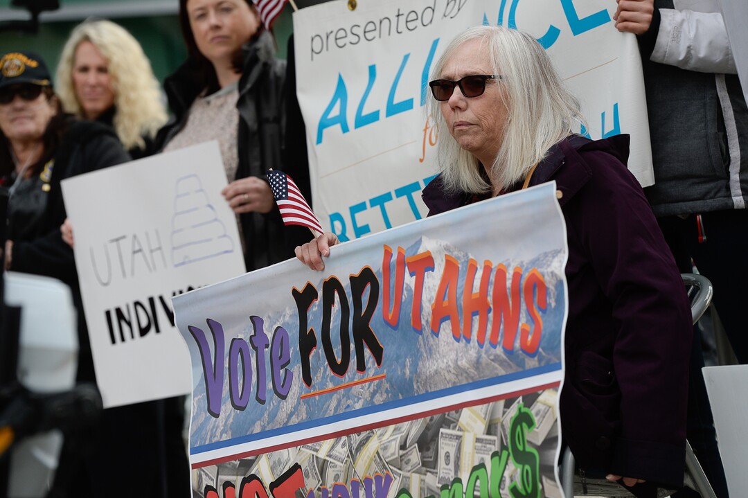 (Francisco Kjolseth  |  The Salt Lake Tribune)  A group of Utahns rally at the Wallace Bennett Federal Building in Salt Lake to tell personal stories of how they might be impacted by the tax reform plans currently on the table in Congress.