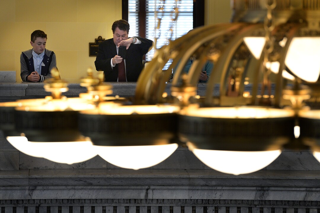 (Scott Sommerdorf   |  The Salt Lake Tribune)   Rep. LaVar Christensen, R-Draper, makes a photo of a group of charter school children singing in the rotunda of the capitol, Thursday, January 25, 2018.