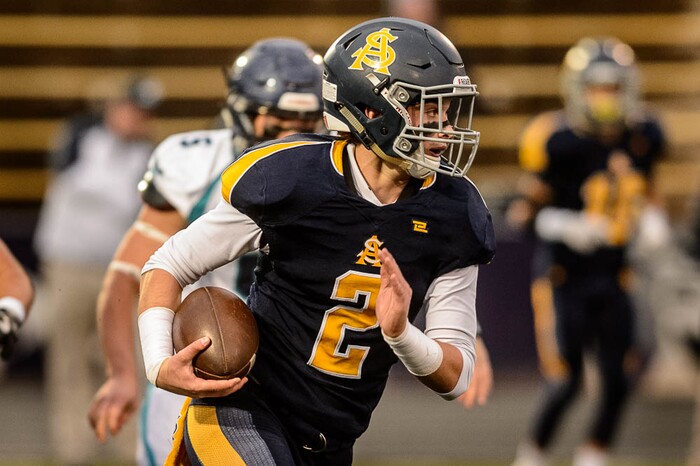 (Trent Nelson | The Salt Lake Tribune)  Summit Academy quarterback Haden Reynolds runs the ball. Summit Academy faces Juan Diego High School in a class 3A state semifinal football game at Weber State University's Stewart Stadium, Saturday November 4, 2017.