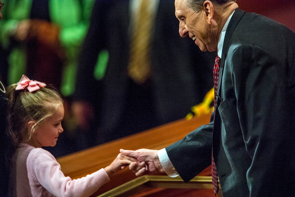 (Chris Detrick  |  Tribune file photo) President Thomas S. Monson greets a young girl during the morning session of the 184th Annual General Conference on April 5, 2014.