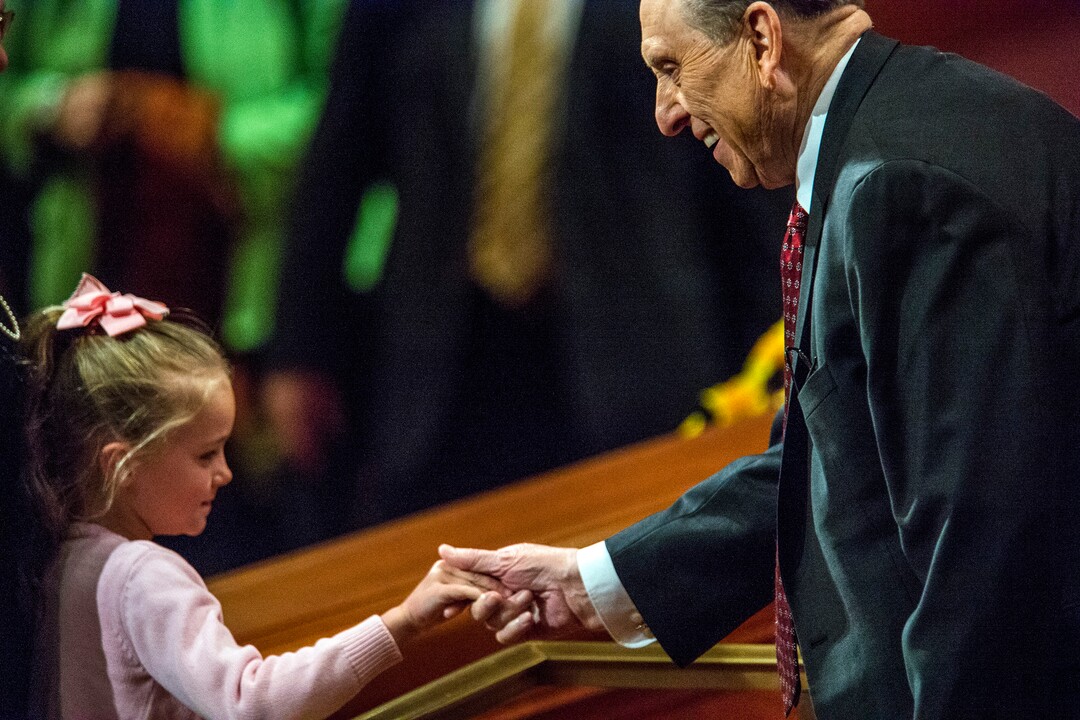 (Chris Detrick  |  The Salt Lake Tribune) President Thomas S. Monson greets a young girl during the morning session of the 184th Annual General Conference on April 5, 2014.