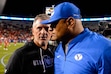 (Trent Nelson  |  The Salt Lake Tribune)  Coaches Kyle Whittingham and Kalani Sitake shake hands after a game in 2019.