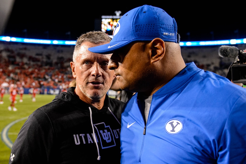 (Trent Nelson | The Salt Lake Tribune) Coaches Kyle Whittingham and Kalani Sitake shake hands after a game in 2019.