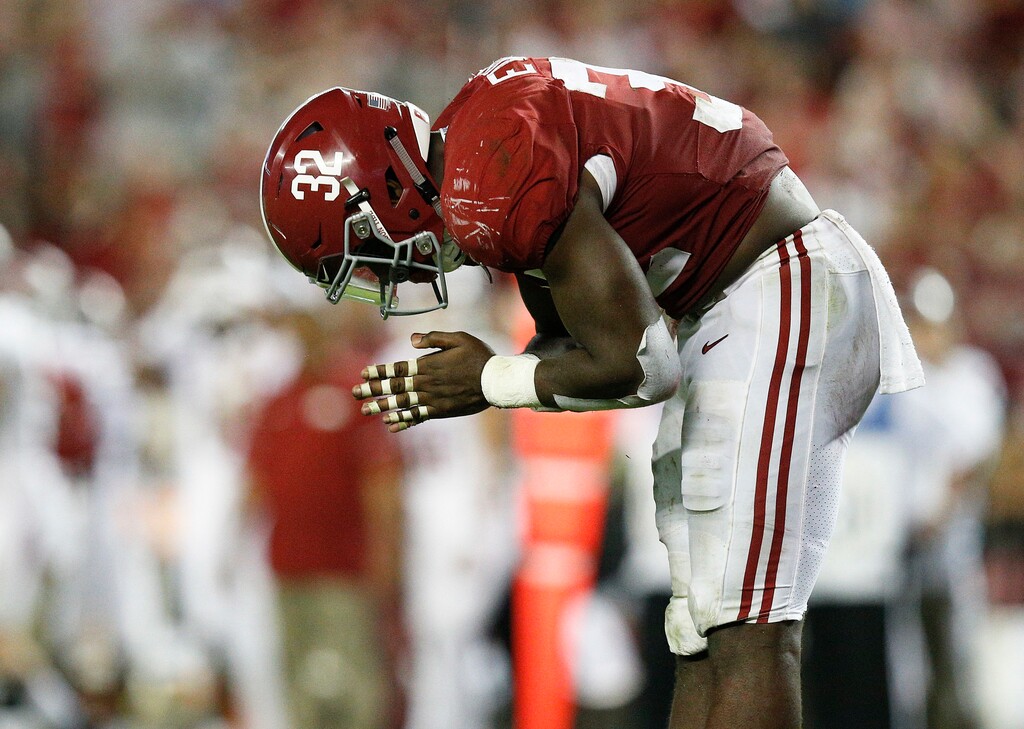 Alabama linebacker Rashaan Evans bows in celebration after he sacked Arkansas quarterback Cole Kelley during the second half an NCAA college football game, Saturday, Oct. 14, 2017, in Tuscaloosa, Ala. (AP Photo/Brynn Anderson)