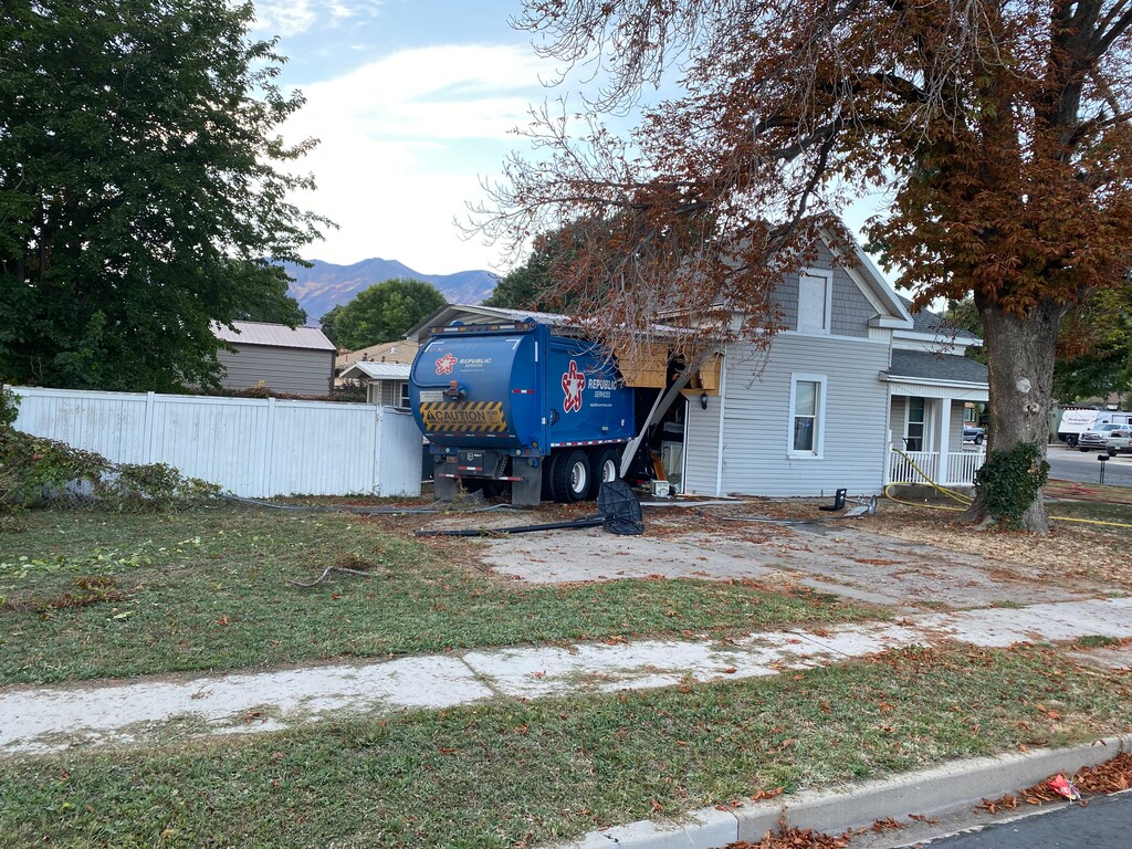 (Spanish Fork Police) A garbage truck is shown Tuesday after police said the driver crashed into a house in Spanish Fork.