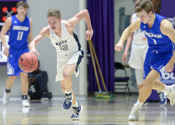(Leah Hogsten  |  The Salt Lake Tribune) Copper Hills' Kylan Shorts (12) grabs Bingham's turnover in the second half. Copper Hills defeated Bingham 61-54 in the 6A High School Boys' Basketball Tournament opening game at Weber State University’s Dee Events Center in Ogden, Tuesday, Feb. 27, 2018. 