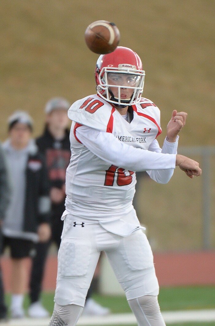 (Leah Hogsten  |  The Salt Lake Tribune) American Fork's quarterback makes the pass. American Fork High School boys' football team East High School during their class 6A state quarterfinal football game, Friday, November 3, 2017