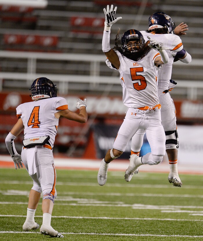 (Francisco Kjolseth  |  The Salt Lake Tribune)  Mountain Crest players Kyler Olsen, Lehi Taukiuvea and Brady Hall, from left, celebrate their 17-7 semifinal win over Stansbury in their class 4A game at Rice-Eccles Stadium, Thursday, Nov. 9, 2017.
