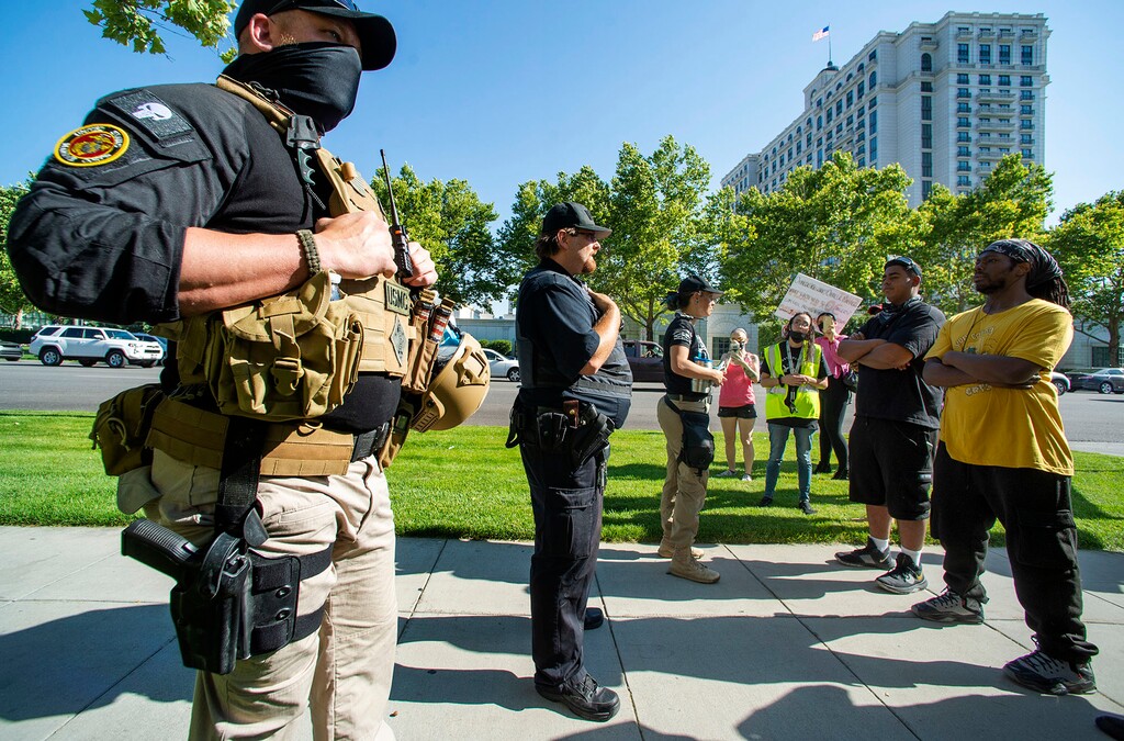 (Rick Egan  |  Tribune file photo)     Counter protesters show up with guns and body armor during a peaceful demonstration at the Salt Lake District Attorney's Office on Wednesday, July 8, 2020.