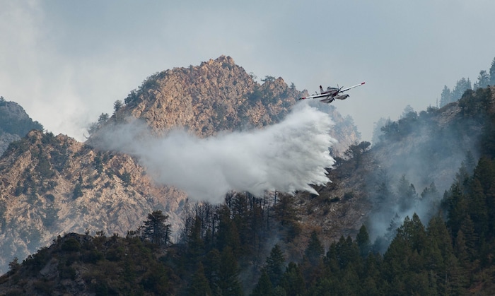 (Francisco Kjolseth  |  The Salt Lake Tribune) Air crews battle a fire in Neffs Canyon on the north side of Mount Olympus on Tuesday, Sept, 22, 2020.