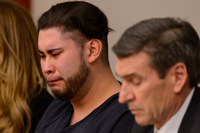 (Trent Nelson | The Salt Lake Tribune)  Abraham Miranda listens to statements from victims and their families at his sentencing in Salt Lake City, Thursday December 21, 2017. Miranda, 19, pleaded guilty to manslaughter counts for a February crash that killed two of his West High School classmates and critically injured a pregnant woman and her baby. At right is Miranda's attorney Greg Skordas.