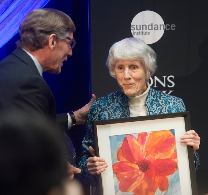 (Rick Egan  |  The Salt Lake Tribune)   Pamela Atkinson, advocate for the homeless, receives an award for her leadership, from Scott Anderson, president and CEO of Zions Bank, at the 2018 Sundance Film Festival Utah Women’s Leadership Celebration in Park City on Thursday, Jan. 25, 2018.