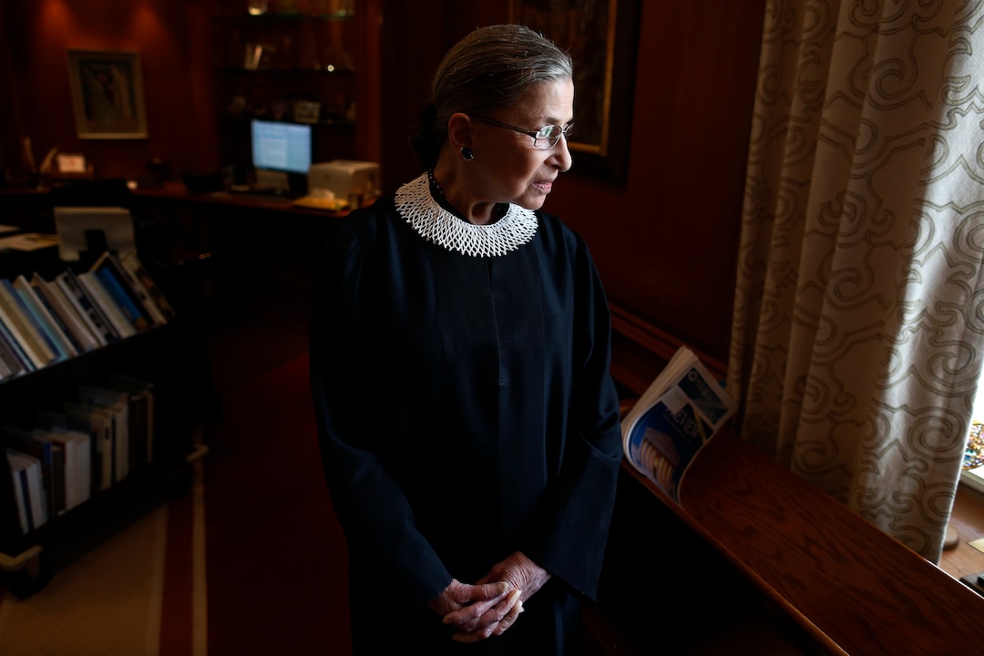 Associate Justice Ruth Bader Ginsburg poses for a photo in her chambers at the Supreme Court in Washington, Wednesday, July 24, 2013, before an interview with the Associated Press. Ginsburg said during the interview that it was easy to foresee that Southern states would push ahead with tougher voter identification laws and other measures once the Supreme Court freed them from strict federal oversight of their elections.  (AP Photo/Charles Dharapak)