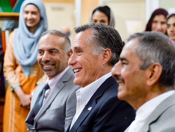 Leah Hogsten  |  The Salt Lake Tribune  Utah Islamic Center president Nasir Khan, left, and trustee board member Nadeem Ahmed, right, share a laugh with Republican U.S. Senate candidate Mitt Romney during a meeting with members of the Utah Islamic Center, Oct. 26, 2018 before friday special prayers.