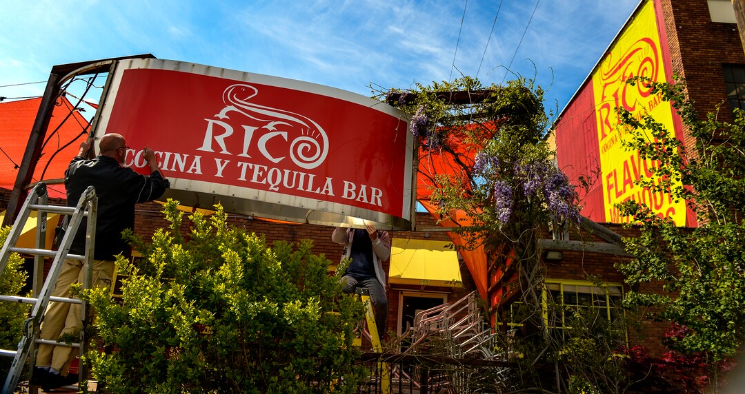 (Leah Hogsten  |  The Salt Lake Tribune)  Tim Huntsman, left, and Jones Piug, with Metro Display Inc., install Rico Cocina y Tequila Bar's new sign.