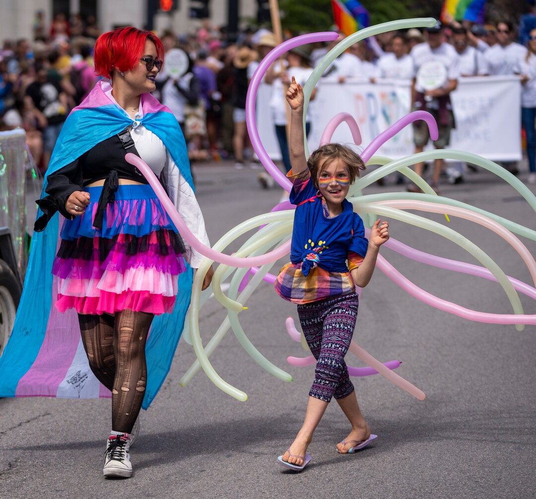 (Rick Egan | The Salt Lake Tribune)  Saerichi and Stella Patack, dance in the Pride Parade, on Sunday, June 4, 2023.