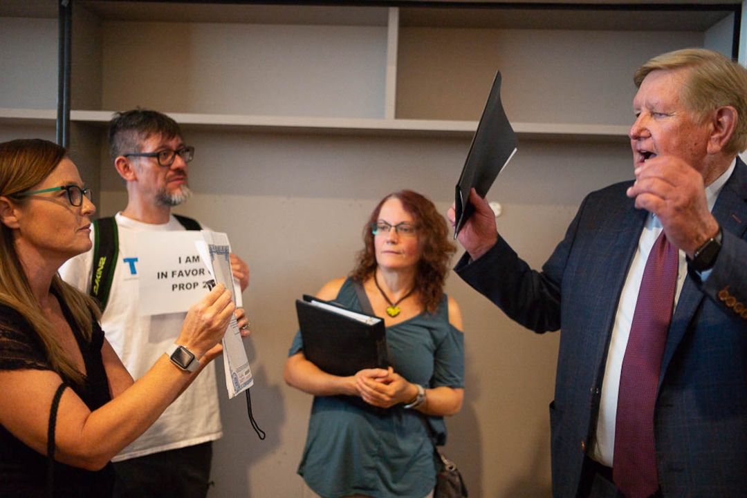(Trent Nelson | The Salt Lake Tribune)  Candi Huff confronts Kem Gardner after a news conference where a coalition including the LDS Church came out against Utah's medical marijuana initiative, in Salt Lake City on Thursday Aug. 23, 2018.