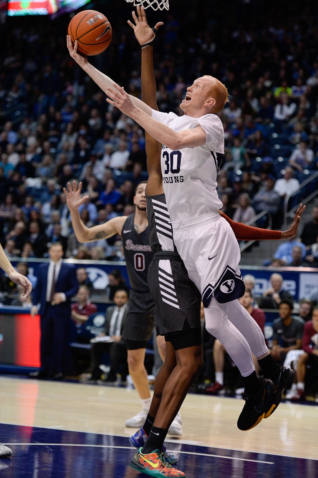 (Francisco Kjolseth  |  The Salt Lake Tribune) Brigham Young Cougars guard TJ Haws (30) looks for an opening past Santa Clara Broncos guard Jalen Williams (24) in the first half as the Brigham Young Cougars host the Santa Clara Broncos at the Marriott Center in Provo, Thursday, Feb. 20, 2020.