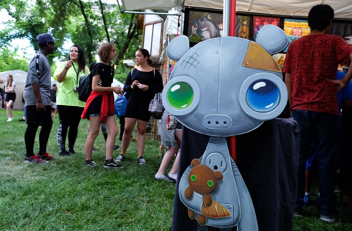 (Francisco Kjolseth  |  The Salt Lake Tribune)  Young crowds fill the booth of Imps and Monsters with works by Justin Hillgrove during the annual 2019 Utah Arts Festival as it kicks off at Library Square and Washington Square in downtown Salt Lake City, Thursday, June 20, 2019, with visual and performance art of all varieties and food for all ages from June 20-23.