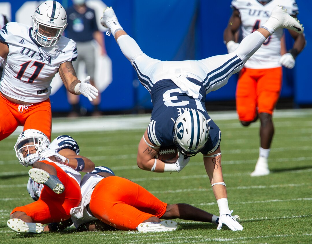 (Rick Egan  |  The Salt Lake Tribune)    Brigham Young Cougars tight end Masen Wake (13) leaps over the top of UTSA Roadrunners cornerback Corey Mayfield Jr. (26) in football action between the Brigham Young Cougars and the UTSA Roadrunners, at Lavell Edwards stadium, Saturday, Oct. 10, 2020.