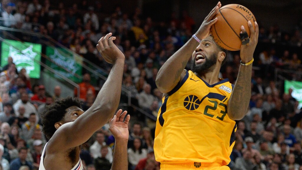 (Francisco Kjolseth | The Salt Lake Tribune) Utah Jazz forward Royce O'Neale (23) goes up against Philadelphia 76ers center Joel Embiid (21) as the Utah Jazz host the Philadelphia 76ers in their NBA basketball game at Vivint Smart Home Arena in Salt Lake City on Wed. Nov. 6, 2019.