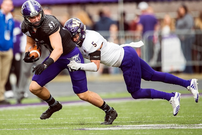 (Chris Detrick  |  The Salt Lake Tribune)  Western Illinois Leathernecks defensive back Aaron Diggs (5) tackles Weber State Wildcats tight end Andrew Vollert (87) during the game at Stewart Stadium Saturday, November 25, 2017.  