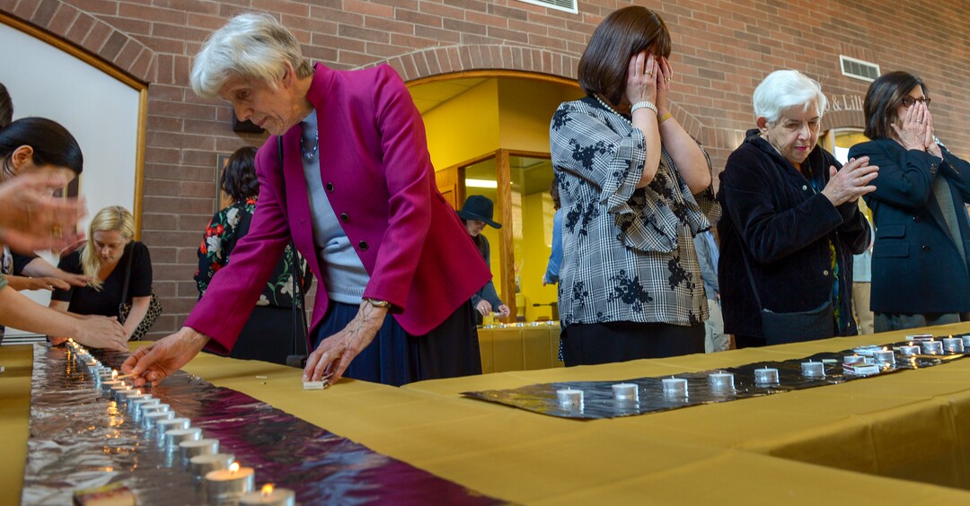 Leah Hogsten  |  The Salt Lake Tribune l-r Pamela Atkinson, Sharonne Zippel, Hilda Isaacson and Joan Kottler say prayers during the Shabbat candle lighting. Jewish women in Utah at the Chabad Lubavitch of Utah and the world over kindled Shabbat candles, May 3, 2019 in loving tribute to Lori Gilbert-Kaye and in prayer for peace and tolerance amongst all of humanity. Lori Kaye was killed during The Chabad of Poway synagogue shooting on the last day of Passover and three others were injured. Although the lighting of Shabbat Candles is uniquely tasked to the Jewish woman, the  community and those wishing to show their support were welcome to attend.