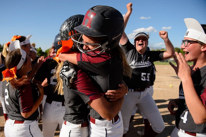 (Trent Nelson | The Salt Lake Tribune)
Herriman players celebrate a win over Syracuse in the 6A Softball State Championship game, Thursday May 24, 2018. At right is Herriman's Cassidy Adams (7), who drove in the winning run.