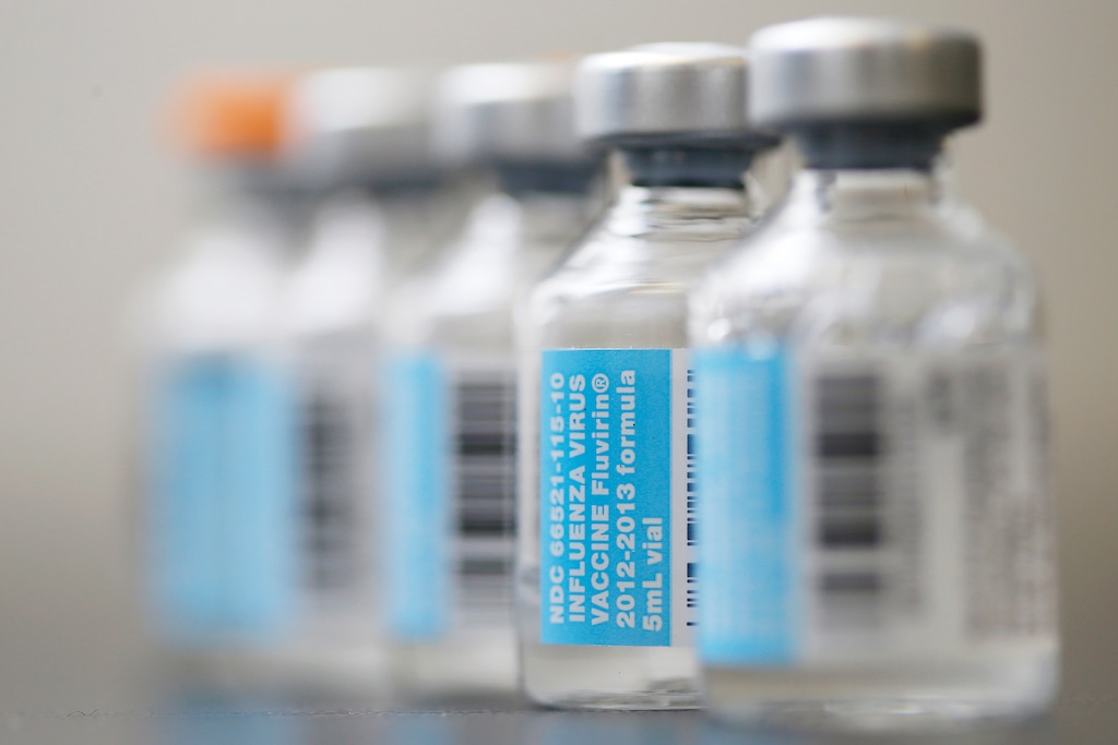(Matt Rourke | The Associated Press) Vials of flu vaccines pictured on Jan. 10, 2013.