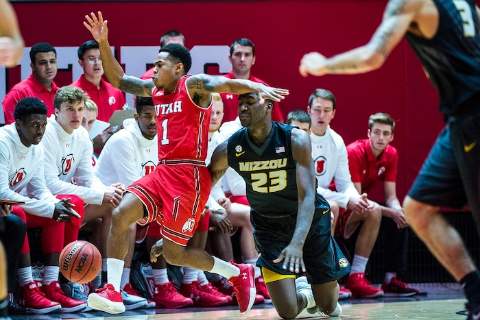 (Chris Detrick  |  The Salt Lake Tribune)  Utah Utes guard Justin Bibbins (1) and Missouri Tigers forward Jeremiah Tilmon (23) go for the ball during the game at the Jon M. Huntsman Center Thursday, November 16, 2017.   