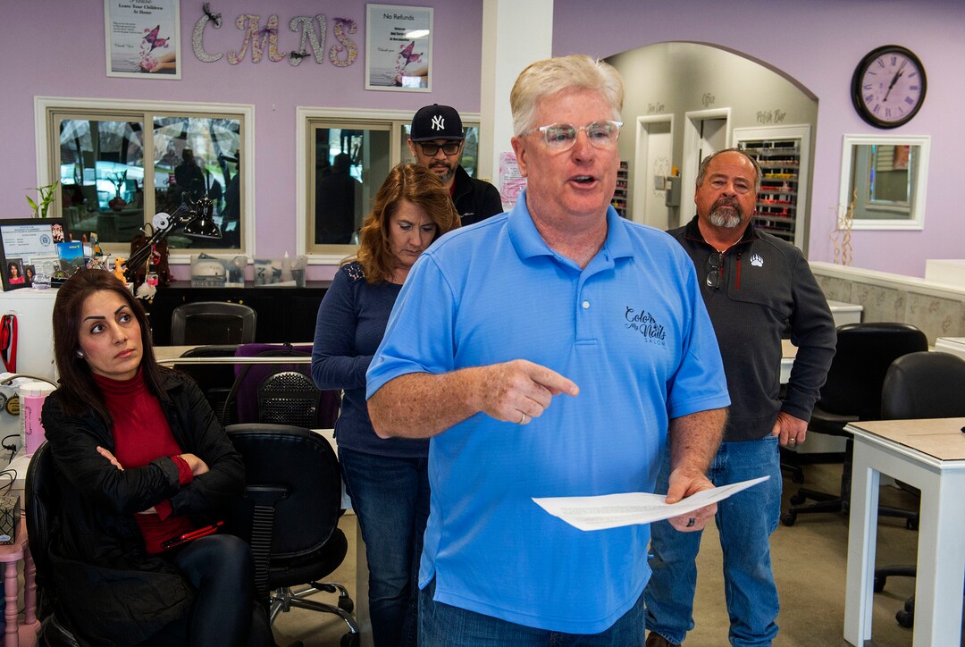(Rick Egan  |  The Salt Lake Tribune)    Surrounded by other small business owners, Doug Jardine owner of Color My Nails Salon, talks about the impact COVID-19 is having on small businesses, during. news conference at his salon in Midvale, Wednesday, March 25, 2020.