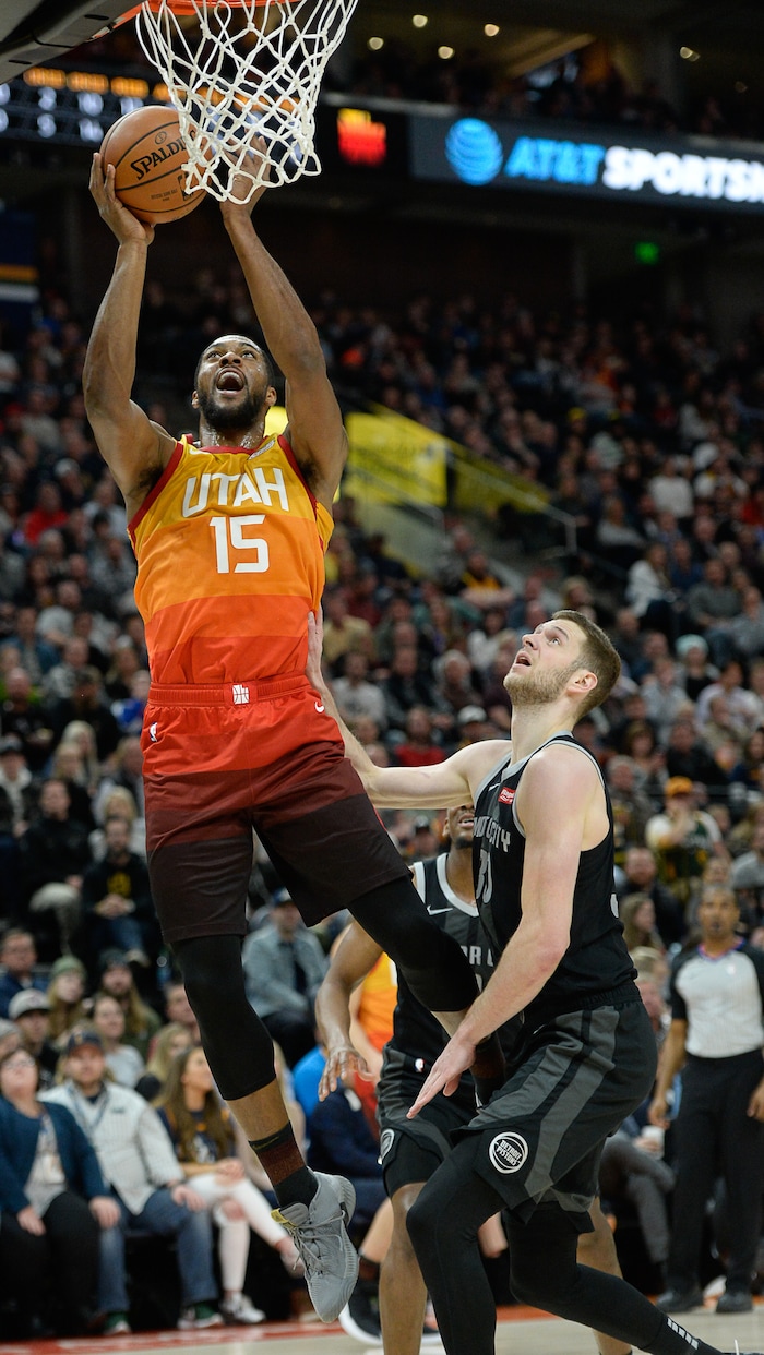 (Francisco Kjolseth  |  The Salt Lake Tribune)  Utah Jazz forward Derrick Favors (15) sails in for a basket against the Pistons in the first half of their NBA game at Vivint Smart Home Arena Monday, Jan. 14, 2019, in Salt Lake City.