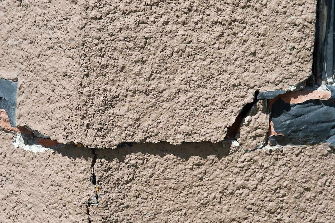 (Rick Egan  |  The Salt Lake Tribune)   Gloria Munns checks out the cracks in her Salt Lake City home, caused by the earthquake, Monday April 13, 2020