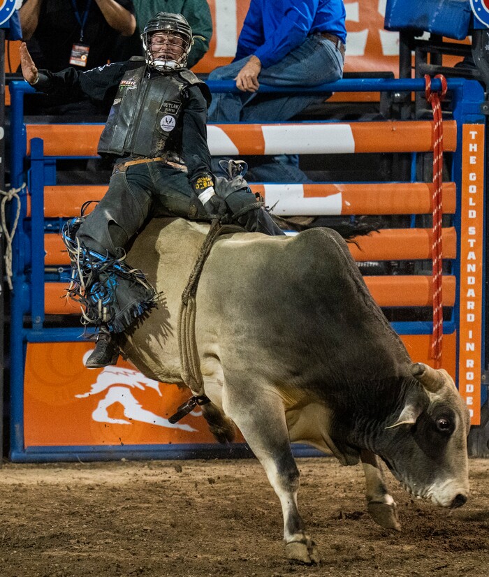 (Rick Egan | The Salt Lake Tribune)  Deklan Garland, from Marlow, Okla., competes in bull riding at the Utah Days of '47 Rodeo at the State Fairpark, on Monday, July 25, 2022.