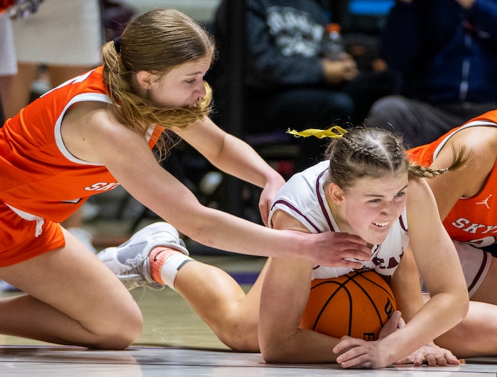 (Rick Egan | The Salt Lake Tribune) Skyridge guard Cambree Blackham (5) goes after a loose ball along with Kennedy Woolston, Lone Peak, in the 6A girls Championship Game between Skyridge and Lone Peak, at Weber State, on Saturday, March 4, 2023.
