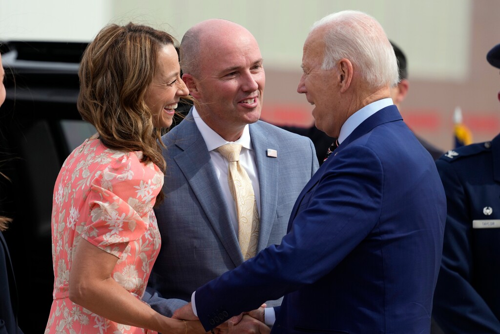 (Alex Brandon | AP) Utah Gov. Spencer Cox and his wife Abby Cox greet President Joe Biden after he arrives at Roland R. Wright International Guard Base, Wednesday, Aug. 9, 2023, in Salt Lake City.
