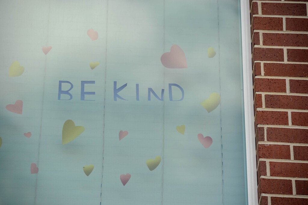 (Trent Nelson  |  The Salt Lake Tribune) The words, "Be kind" on an apartment window in Salt Lake City on Monday, March 30, 2020.