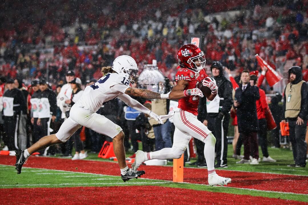(Meg Oliphant | Special to The Tribune) Utah wide receiver Jaylen Dixon (25) scores a touchdown ahead of Anthony Ivey #12 of the Penn State Nittany Lions in the fourth quarter at Rose Bowl Stadium on Jan. 2, 2023 in Pasadena, California.