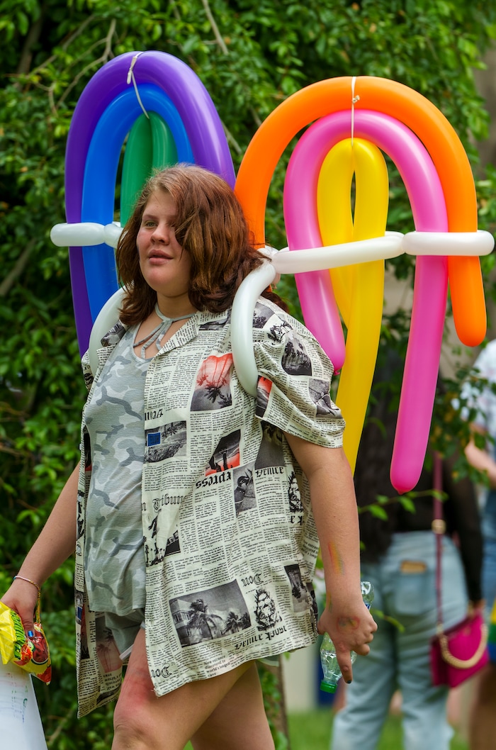 (Leah Hogsten | The Salt Lake Tribune)  Kenneidy Trueh-Reid sports balloon wings at the Utah Pride Festival at Washington Square, Saturday, June 4, 2022. 