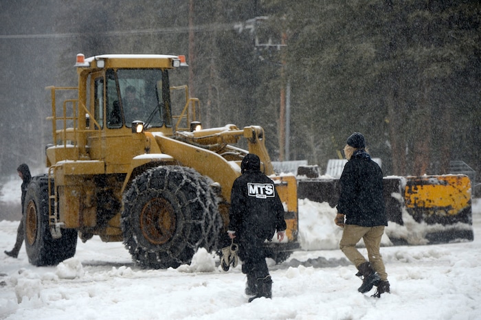 (Al Hartmann | The Salt Lake Tribune)
Employees at Brighton ski resort start to deal with the heavy, wet snow starting to pile up Friday morning at the top of Big Cottonwood Canyon.