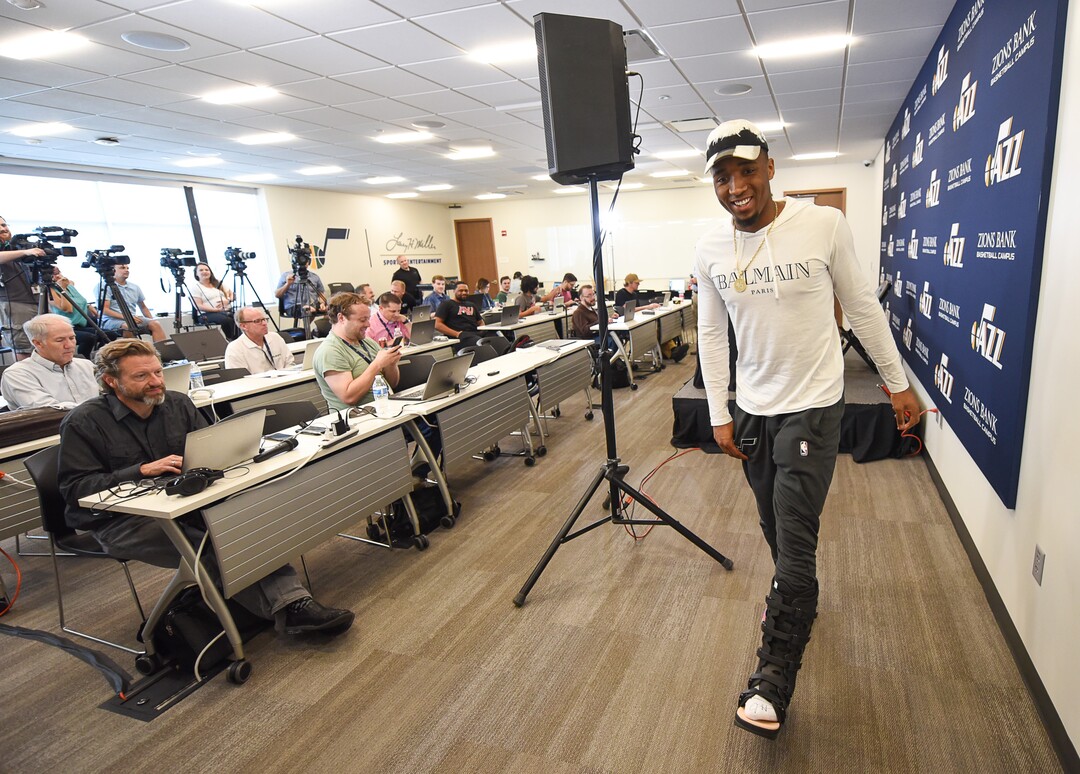 (Francisco Kjolseth  |  The Salt Lake Tribune)  Utah Jazz      guard Donovan Mitchell says his foot is feeling better but wears a boot as a precaution as he finishes with the media during exit interviews at their practice facility in Salt Lake City Wed., May 8, 2018, after losing to the Houston Rockets in game 5 of their Western Conference Semifinals during the 2018 NBA Playoffs.