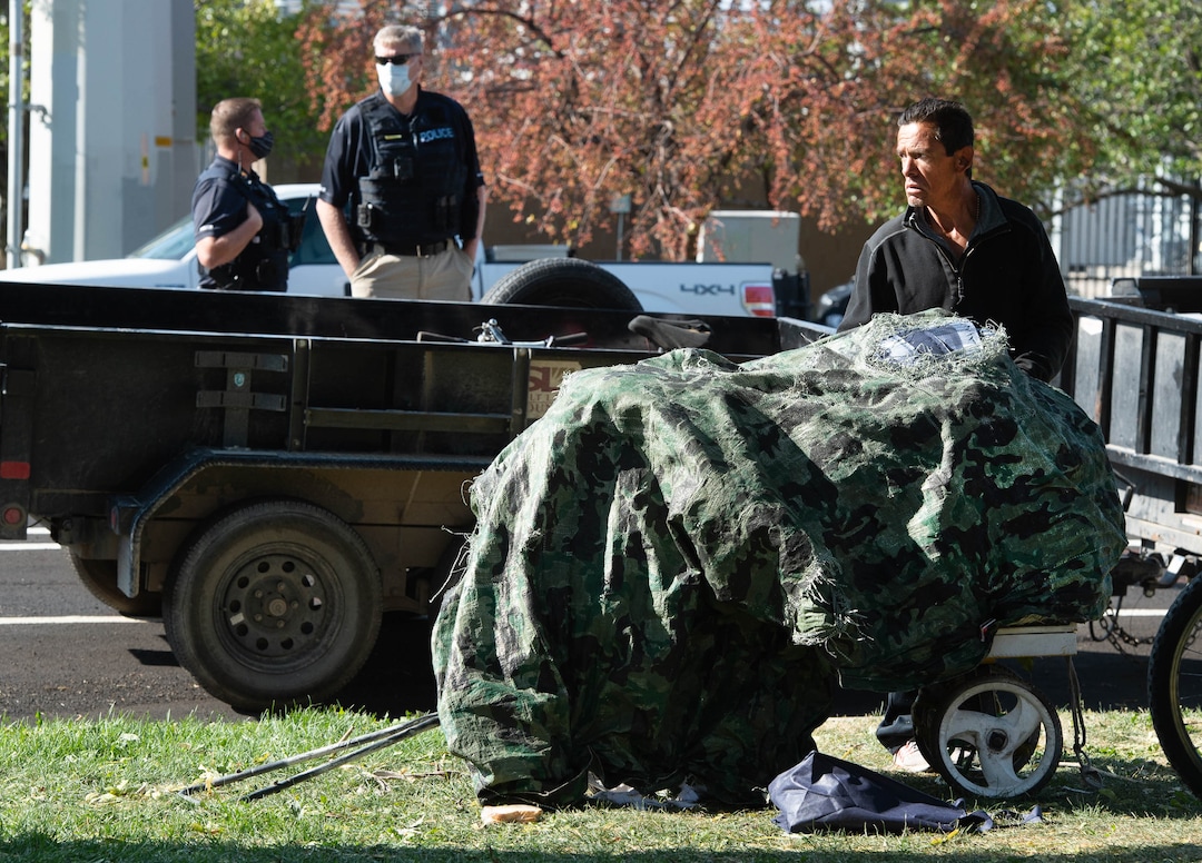 (Francisco Kjolseth  |  The Salt Lake Tribune) Daniel Castiano is forced to pack up his belonging as the Salt Lake County Health Department cleans up the homeless camp set up near Taufer Park in Salt Lake City on Thursday, Sept. 10, 2020. Notified the day before, the health department, backed by police, cleaned up the camps as homeless advocates confronted the police abhorring their actions.