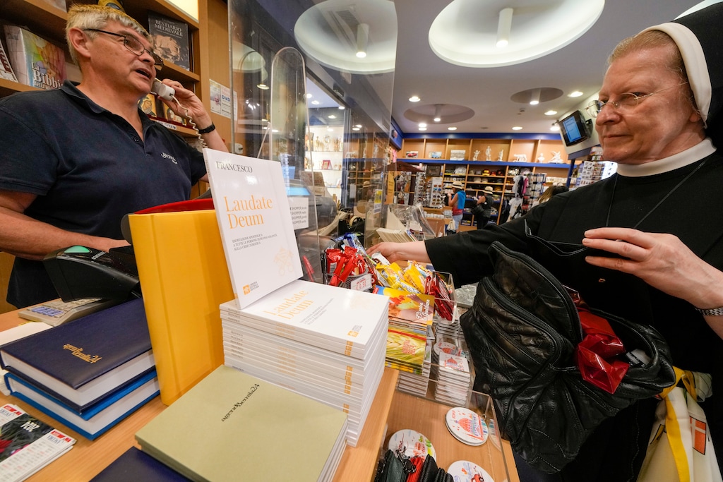 (Andrew Medichini | AP) Copies of Pope Francis' latest encyclical letter on environment, "Laudate Deum," are on sale in a bookshop in Rome, Wednesday, Oct. 4, 2023. Pope Francis shamed and challenged world leaders on Wednesday to commit to binding targets to slow climate change before it's too late, warning that God's increasingly warming creation is fast reaching a "point of no return."