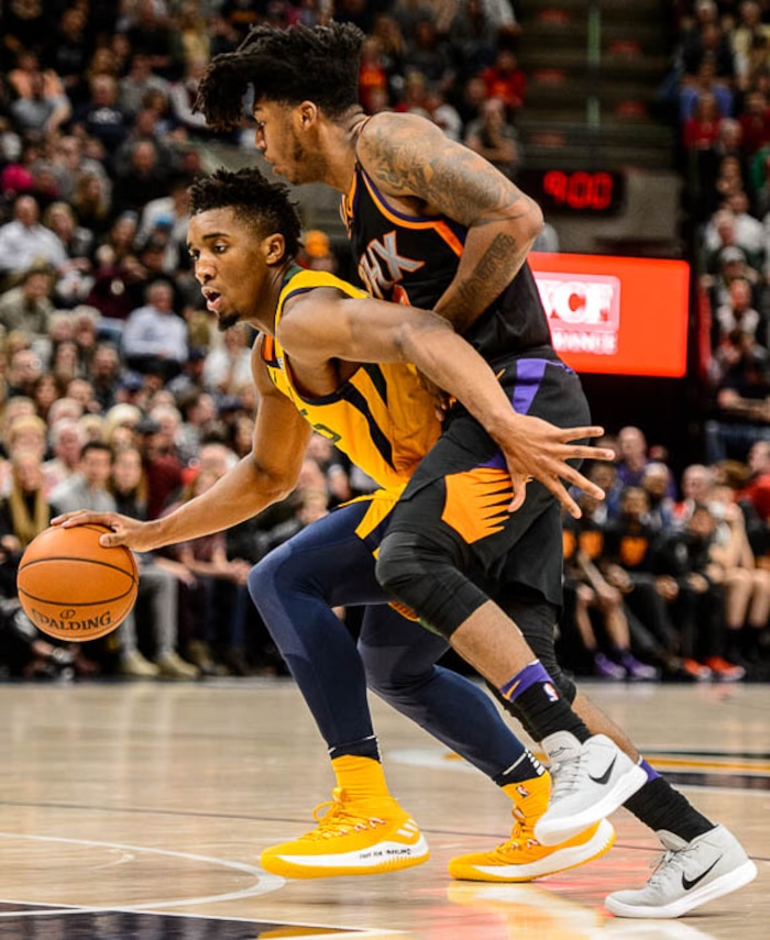 (Trent Nelson | The Salt Lake Tribune)  Utah Jazz guard Donovan Mitchell (45) defended by Phoenix Suns guard Elfrid Payton (2) as the Utah Jazz host the Phoenix Suns, NBA basketball in Salt Lake City, Wednesday Feb. 14, 2018.