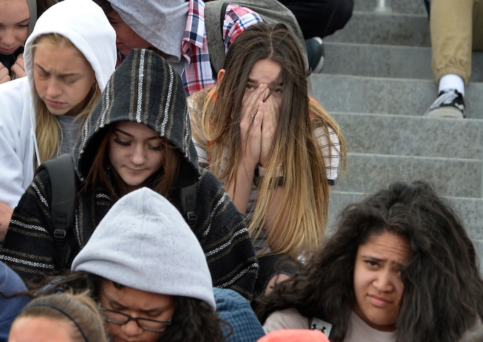 Scott Sommerdorf | The Salt Lake Tribune
Students at Brighton High observe a minute of silence for each sign held up for all of the 17 students and staff killed at Marjory Stoneman Douglas High School, during their walkout at Brighton High School, Wednesday, March 14, 2018.
