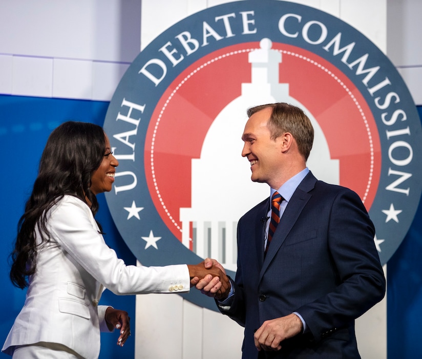 (Scott G. Winterton | Deseret News, pool photo) Congresswoman Mia Love and Salt Lake County mayor Ben McAdams shake hands as they take part in a debate at the Gail Miller Conference Center at Salt Lake Community College in Sandy as the two battle for Utah's 4th Congressional District on Monday, Oct. 15, 2018.