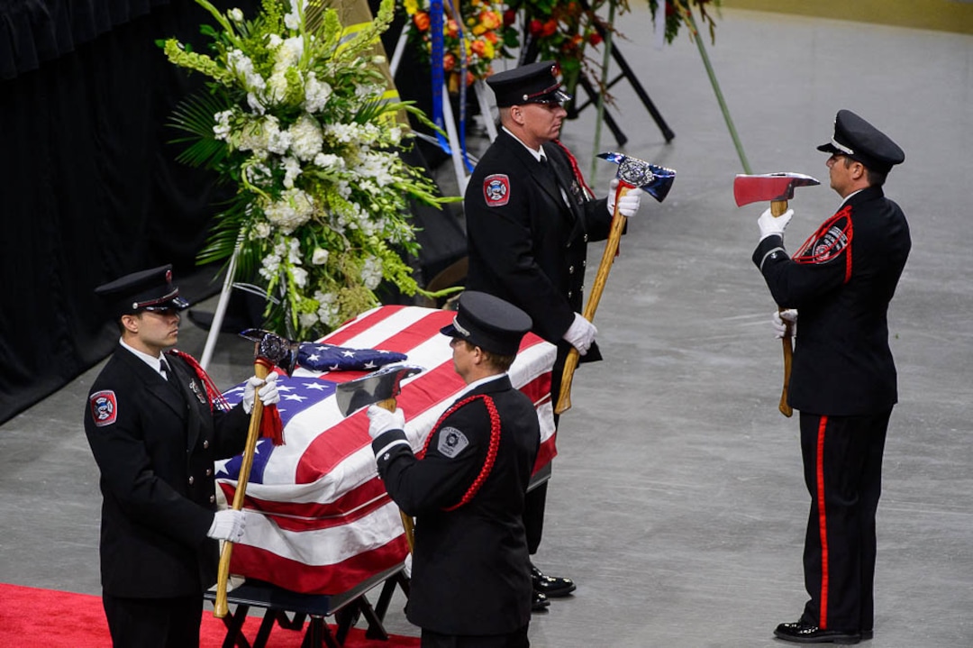 (Trent Nelson | The Salt Lake Tribune)  Honor Guard at the funeral services for Battalion Chief Matthew Burchett at the Maverik Center in West Valley City, Monday Aug. 20, 2018.