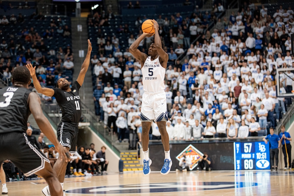 (Rachel Rydalch | The Salt Lake Tribune) Brigham Young Cougars forward Gideon George (5) shoots a three-point shot during a game against the Long Beach State 49ers at the Marriott Center on Wednesday, March 16, 2022.