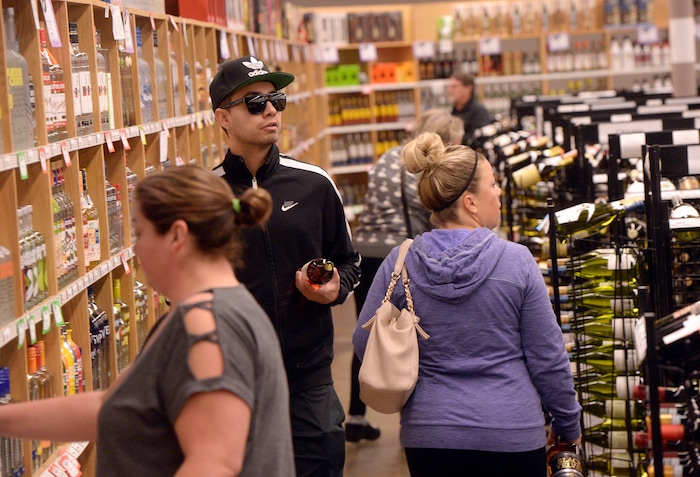 (Al Hartmann  |  The Salt Lake Tribune) 	Shoppers fill the ailes at Cottonwood Heights state liquor store.  The Wednesday before Thanksgiving is typically one of the busiest days for liquor sales in Utah. Customers typically line up outside before the 11 a.m. opening.   Extra employees work to handle the holiday rush. 