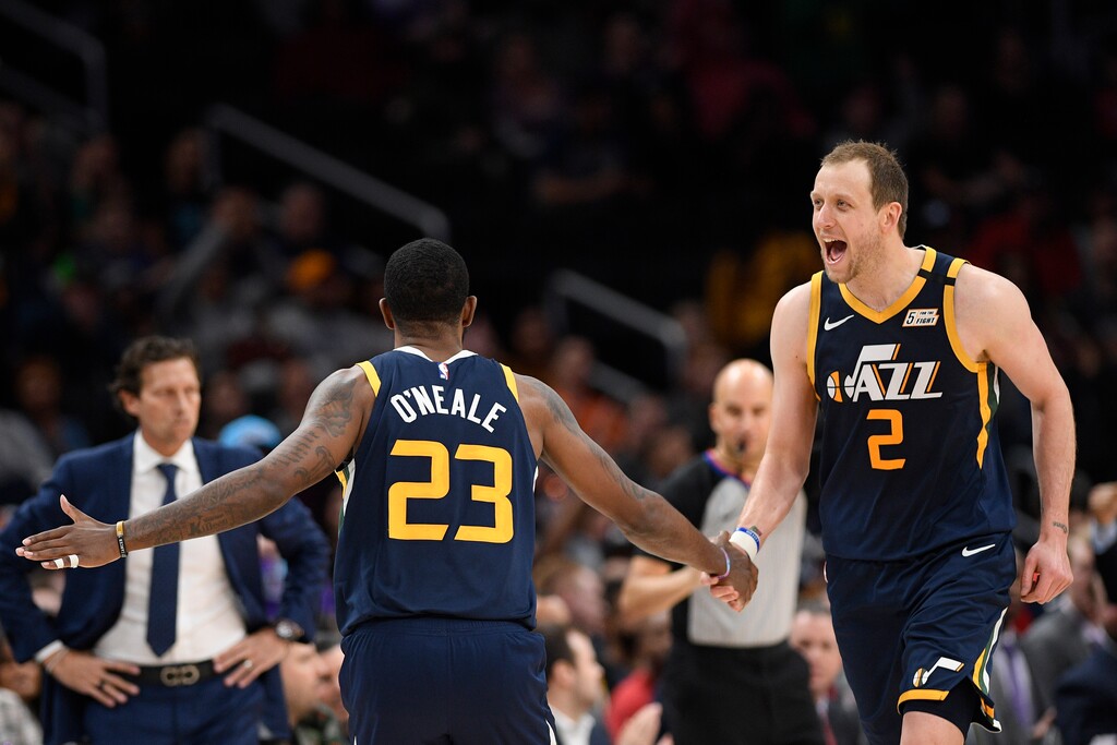 Utah Jazz forward Royce O'Neale (23) reacts with teammate forward Joe Ingles (2) after making a three-point basket during the second half of an NBA basketball game against the Washington Wizards, Sunday, Jan. 12, 2020, in Washington. (AP Photo/Nick Wass)